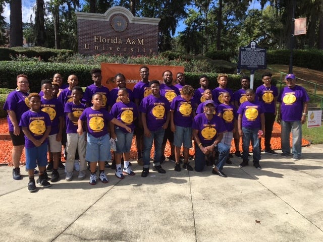 Members of the Manhood Youth Foundation during a tour of FAMU during Homecoming weekend. [Special to the Guardian]
