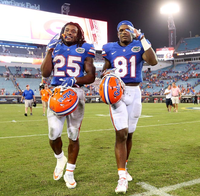 Florida running back Jordan Scarlett, left, and wide receiver Antonio Callaway were key contributors in last year's 24-10 win over Georgia in Jacksonville. Because of a season-long suspension, both playmakers won't be helping out the Gators this Saturday. [File]