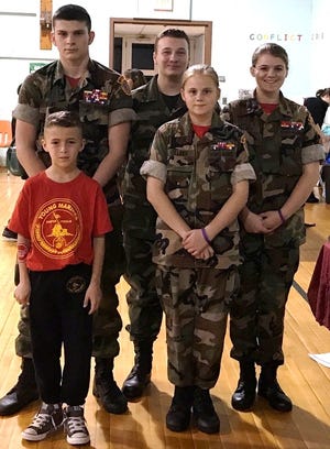 Old Colony Young Marines attended Red Ribbon night at Decas Elementary. Pictured here are: Angelina Kelliher, 15; Alannah Kelliher, 12; Jacob Payne, 16; Nick Ratliff, 15; and Riley Freeman, 8.

[Wicked Local Photo/Mary McKenzie]