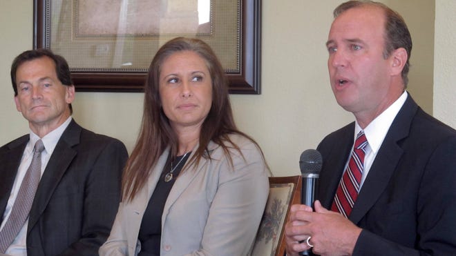 Flagler County Judge Melissa Moore Stens, flanked by Circuit Judges Dennis Craig and Lee Smith at a Flagler County Chamber breakfast, has the highest caseload of any county-court judge in Florida. 'News-Journal/Matt Bruce]