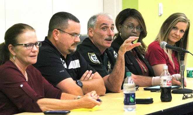 Voluisa County Sheriff Mike Chitwood, center, makes a point during a panel discussion with, from left, Rhonda Harvey, chief operating officer of Stewart-Marchman-Act Behavioral Healthcare; James Lynam with the Florida Department of Children and Families; Demika Jackson with Lutheran Services Florida; and Sarah Sheppard, a parent partner with the Healthy Start Coalition of Flagler and Volusia Counties. The panel discussed the ongoing opioid epidemic on Friday, Oct. 27, 2017, during One Voice for Volusia's Health and Human Services Summit at the Ocean Center. [News-Journal/David Tucker]