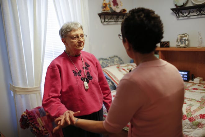 Martha Hays, left, works with nurse Sandy Miller, right, during a balance evaluation at the Hays home in Columbus, Ohio. As people live longer with complex chronic diseases, more people are hiring geriatric care managers to help them navigate increasingly complex problems as they age.[Joshua A. Bickel/The Columbus (Ohio) Dispatch]