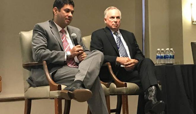 Alex Richard, left, state director for Sen. Jerry Moran, and State Rep. Don Hineman, R-Dighton, speak Thursday at the Kansas Economic Policy Conference put on by the Institute for Policy and Social Research at the University of Kansas. [ALLISON KITE/TOPEKA CAPITAL-JOURNAL]