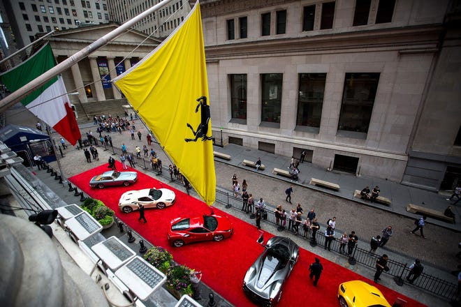 Ferraris sit parked in front of the New York Stock Exchange in New York on Oct. 9. [Bloomberg / Michael Nagle]