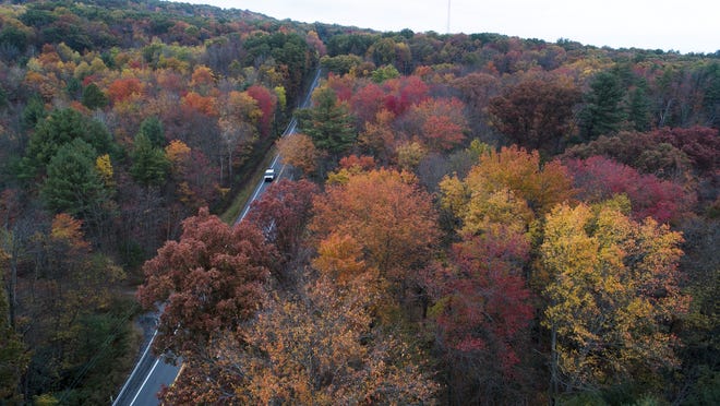 Fall colors beginning to show along Route 209 in Reilly Township, Schuylkill County, Pa. on Oct. 23. Across the United States, the first freeze has been arriving further and further into the calendar, according to more than a century of measurements from weather stations nationwide. [David McKeown / Republican-Herald via AP]