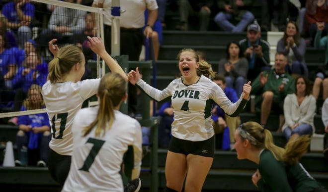 Dover's Kyra Cantwell , center, lets out a scream of excitement after the Green Wave swept Salem BSaturday night in D-I quarterfinal action in Dover. [Shawn St. Hilaire/Fosters.com]