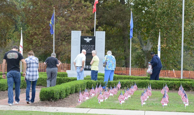 People look over the Walk of Honor with its latest addition, the Korean and Vietnam War Monument at Tiffany West Park. [JANET S. CARTER / THE FREE PRESS]