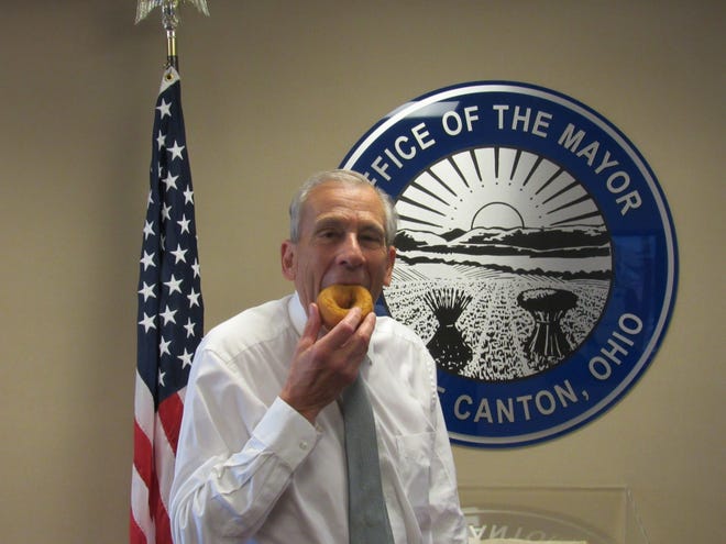 Canton Mayor Tom Bernabei enjoys a Salvation Army doughnut to help spread the message about the organization's work. (Submitted photo)