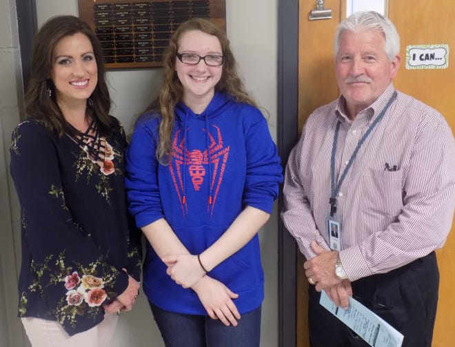 Greenwood High School senior Katelyn Lyons, center, stands with teacher Nikki Adams, left, and principal Jerry Efurd after being named honorable mention winner of the local "It Can Wait" essay contest. [MARDI TAYLOR/TIMES RECORD]