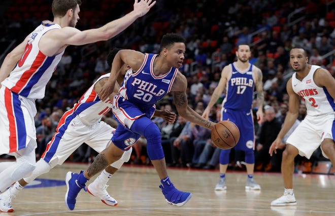 Sixers guard Markelle Fultz drives to the basket during the second half of Monday's game against the Pistons. [Carlos Osorio / The Associated Press]