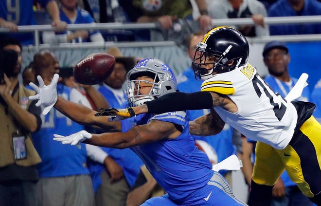 Pittsburgh Steelers cornerback Joe Haden (21) deflects a pass intended for Detroit Lions wide receiver Marvin Jones during the first half Sunday in Detroit. [AP Photo/Rick Osentoski]