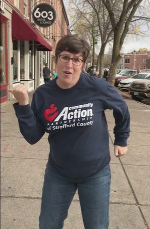 A screenshot of Betsey Andrews Parker dancing on Central Avenue in her viral video to promote an upcoming fundraiser. Since Friday, the video has garnered another million views.