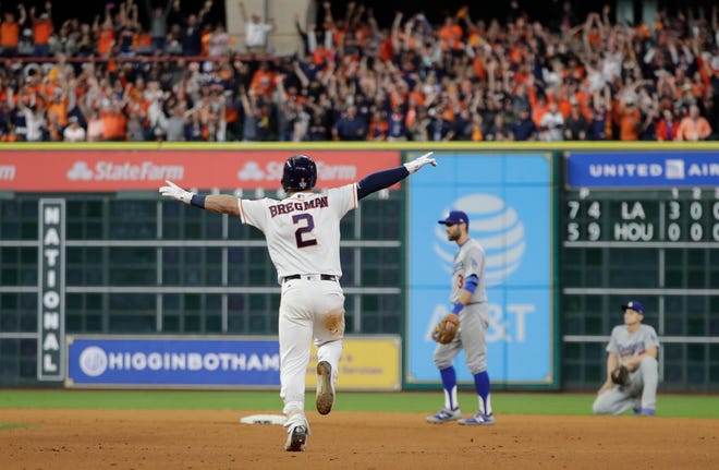 Houston Astros' Alex Bregman reacts after hitting in the game-winning run during the 10th inning of Game 5 of baseball's World Series against the Los Angeles Dodgers Monday, Oct. 30, 2017, in Houston. The Astros won 13-12 to take a 3-2 lead in the series. (AP Photo/David J. Phillip)