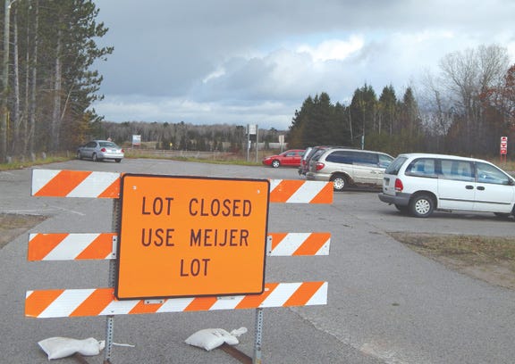 The carpool near the intersection of Three Mile and the I-75 southbound off-ramp was still being utilized on Monday afternoon, but will officially close on Nov. 10. Motorists are being directed to the nearby Meijer parking lot where a new carpool area has been established.