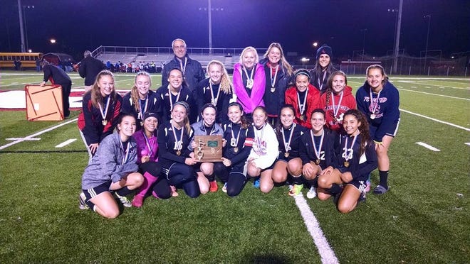 Photo courtesy of Ed Marsh

The New Philadelphia girls' soccer team celebrates its Division II district title last week. The Quakers will play John Glenn in a regional semifinal tonight.