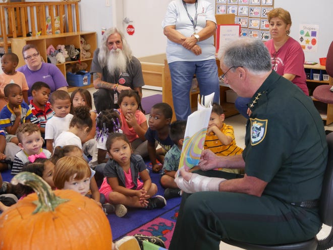 Sheriff Mike Chitwood met and read to the children at the WVEC Head Start center in DeLand on Oct. 18, to celebrate the Head Start Awareness Month initative "Books Building Bridges." Through this initiative, Head Start programs across the country are partnering with local police departments to ensure that reading and understanding each other are a part of their lives. [Photo provided]