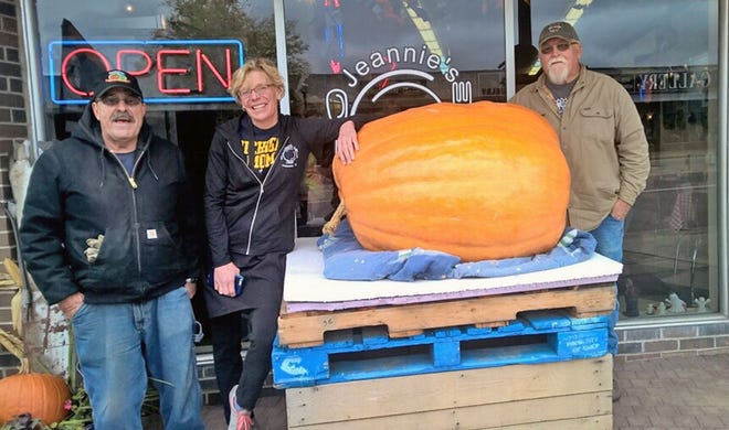 From left, Charlie Hoff, Jeanne Wood and James Marvin standing with the 443 pound pumpkin outside of Jeannie’s Diner Saturday. COURTESY PHOTO