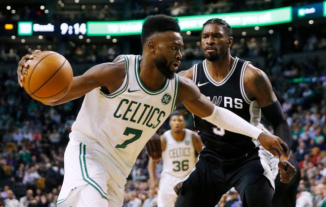 Boston Celtics' Jaylen Brown drives past San Antonio Spurs' Brandon Paul during the third quarter of an NBA basketball game in Boston, Monday, Oct. 30, 2017. The Celtics won 108-94.