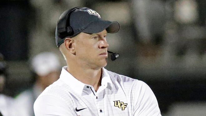 In this Aug. 31, 2017, photo, Central Florida head coach Scott Frost watches his team against Florida International during the second half of an NCAA college football game, in Orlando, Fla. (Associated Press, file)