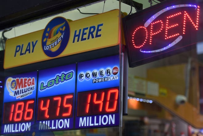 In this Friday, July 7, 2017 file photo, signs display the lottery jackpot prizes at a store in downtown Chicago. [AP file photo]