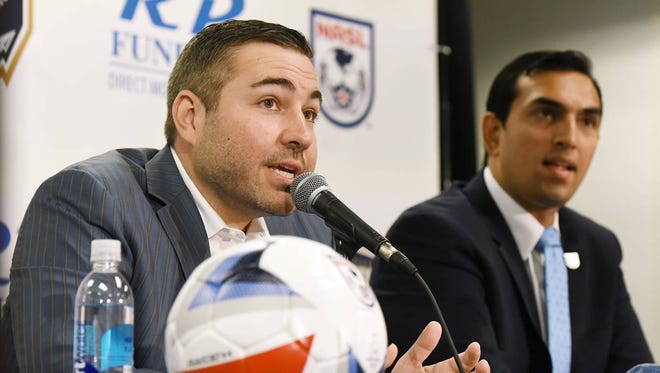 Jacksonville Armada owner Robert Palmer is pictured alongside North American Soccer League commissioner Rishi Sehgal at his July introduction. The NASL, which seeks a preliminary injunction to restore its Division II status, is losing two clubs for 2018. (Bob Self/Florida Times-Union)