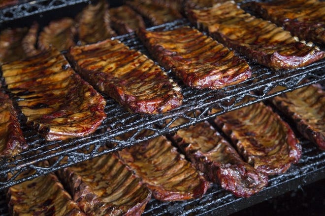 Ray Ray's, whose ribs are pictured here, and Land-Grant are teaming up with a food truck planned at Land-Grant's location in Franklinton. [Dispatch file photo]