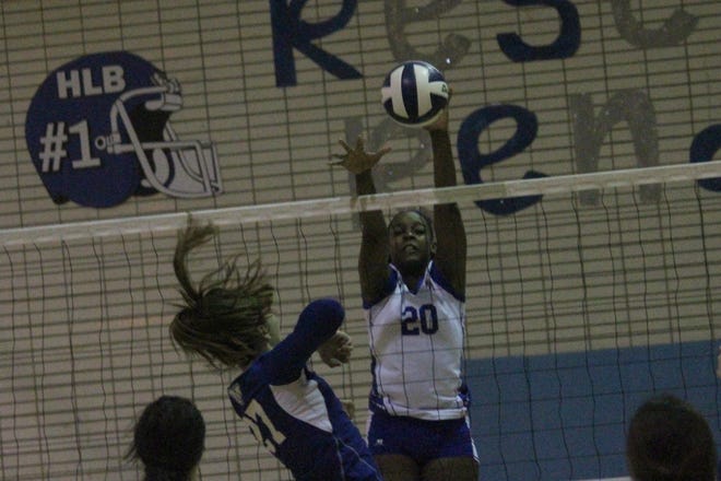 H.L. Bourgeois’ Da’Zhane’ Gasery (20) blocks a shot from Mandeville's Gabby Oos during Wednesday’s first round of the Division I state volleyball playoff match in Gray. [Keyon K. Jeff/Correspondent – houmatoday/dailycomet]