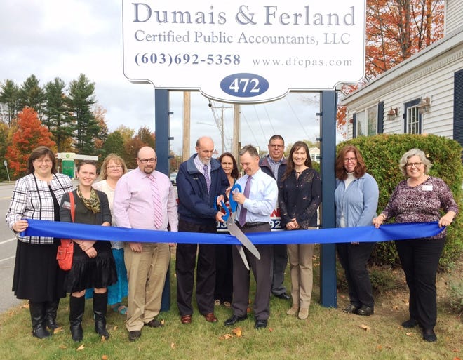 Taking part in a ribbon cutting celebrating the company's new location are Dumais & Ferland, CPAs, LLC Employee Kelly Bilodeau; Chamber board member Caroline D. of Somersworth Storage, Employees Jaci Lawson; Rob Fuller, CPA; Thomas Dumais, CPA; Deb Greene; and Kevin Ferland, CPA; Chamber Board Member Paul Robidas of American Ambulance, Employees Tracy Howe, CPA, Tina Perkins, and Chamber Board Member Kathy Sessler of Cornerstone VNA. [Courtesy photo]
