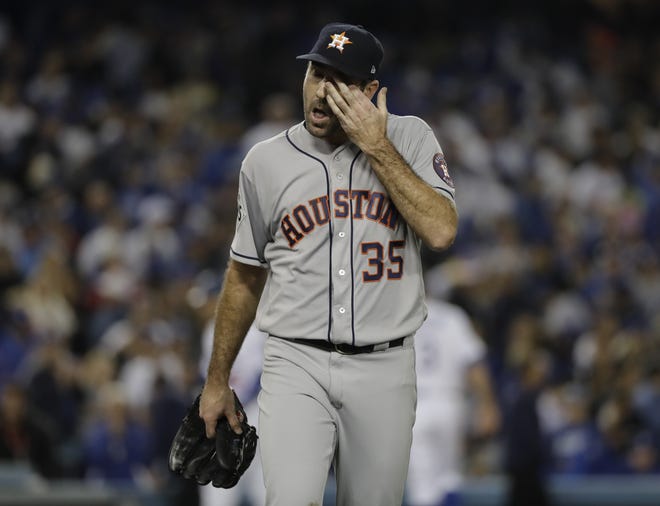 Houston Astros starting pitcher Justin Verlander walks aback to the dugout after the Los Angeles Dodgers scored two runs during the sixth inning of Game 6 of baseball's World Series Tuesday, Oct. 31, 2017, in Los Angeles. (AP Photo/David J. Phillip)