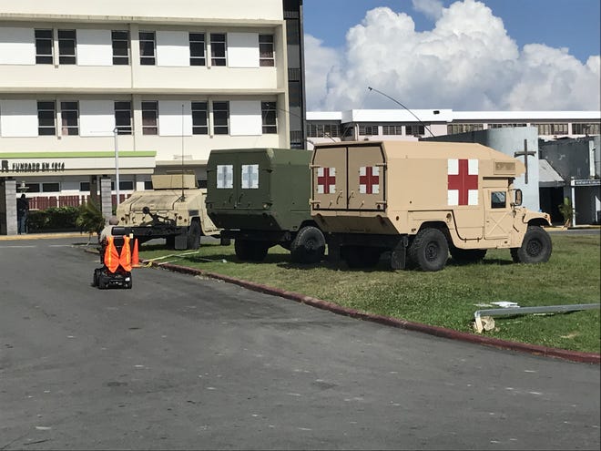 Medical vehicles sit outside of a hospital in Puerto Rico. [PHOTO PROVIDED]