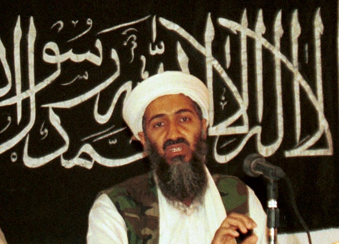 In this 1998 file photo made available on March 19, 2004, Osama bin Laden is seen at a news conference in Khost, Afghanistan. The CIA’s release of documents seized during the 2011 raid that killed al-Qaida leader Osama bin Laden has again raised questions about Iran’s support of the extremist network leading up to the Sept. 11 terror attacks. U.S. intelligence officials and prosecutors have long said Iran formed loose ties to the terror organization from 1991 on, something noted in a 19-page report in Arabic included in the release of some 47,000 other documents by the CIA. Iran always has denied any links. (AP Photo/Mazhar Ali Khan, File)