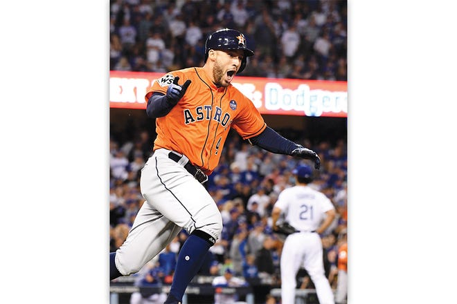Houston's George Springer hits a two-run home run against Los Angeles pitcher Yu Darvish (21) in the second inning during Game 7 of the World Series at Dodger Stadium in Los Angeles on Wednesday.
