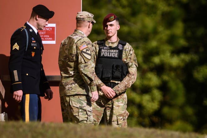 Sgt. Bowe Bergdahl, left, leaves the Fort Bragg courtroom facility after a sentencing hearing on Tuesday, Oct. 31, 2017, on Fort Bragg, N.C. Bergdahl faces up to life in prison after pleading guilty to desertion and misbehavior before the enemy for walking off his remote post in Afghanistan in 2009. (AP Photo/The Fayetteville Observer, Andrew Craft)