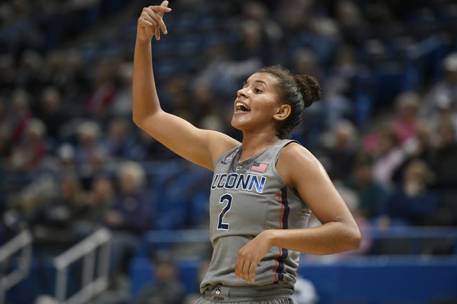 Connecticut's Andra Espinoza-Hunter signals to her teammates during the second half Wednesday's exhibition game in Hartford, Conn. [JESSICA HILL/ASSOCIATED PRESS]