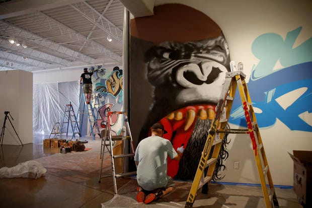 Graffiti artist Robert Levering, aka ENTAKE or Bobby Entaker, of Oklahoma City, works on his display for the exhibit "Not For Sale: Graffiti Culture in Oklahoma" at Oklahoma Contemporary Arts Center in Oklahoma City. Photo by Bryan Terry, The Oklahoman