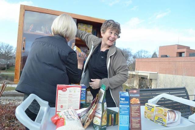 Robin Burke (right) and Jennifer Wilson (left) put together the Blessing Box in Nov. of 2016. The group, along with Melanie Tolle, now assist in the filling of the Blessing Box. FILE PHOTO/THE PERRY CHIEF
