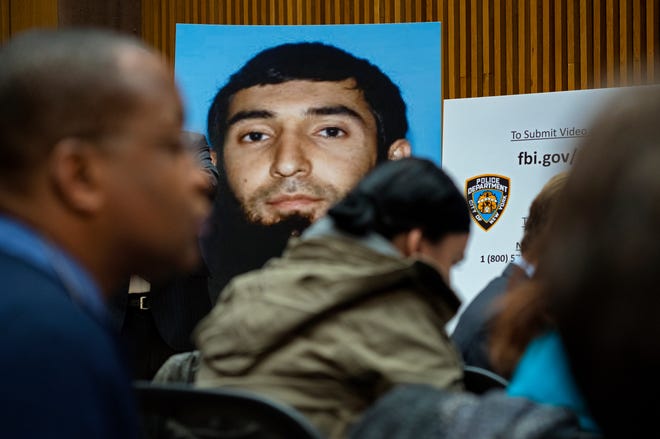 A photo of Sayfullo Saipov is displayed at a news conference at One Police Plaza in New York Wednesday. [The Associated Press]