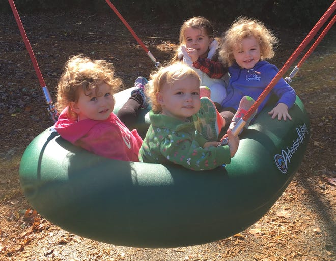 Enjoying a raft on dry land at Reynolds Playground are, front row, from left, Whitney Connors and Grace Paster; back row, from left, Chloe Bass and Maddie Paster.

[Wicked Local photo/Adam Silva]