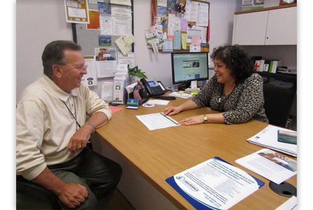 COUNSELING SESSION — Information & Options Counseling Director Margie DiDona talks with client, Joe Buckner, who is also a SHIIP volunteer and former SHIIP Volunteer of the Year and Governor’s Award winner. (Contributed photo)
