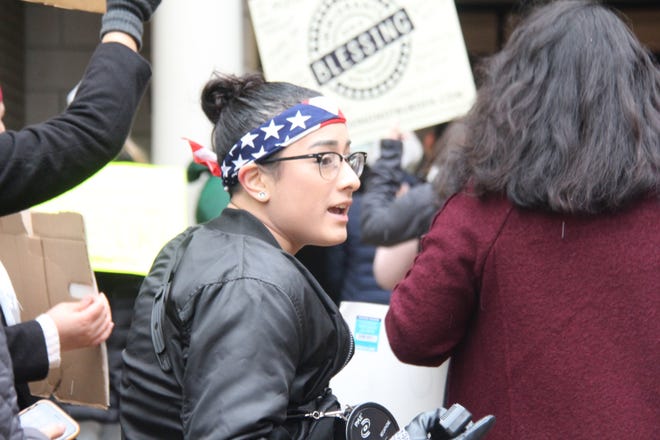 Jocelyn Gallegos, a sophomore at Hope College and president of the Latino Student Organization, marches in the DACA March in downtown Holland on Oct. 31, 2017. [Jake Allen/Sentinel staff]