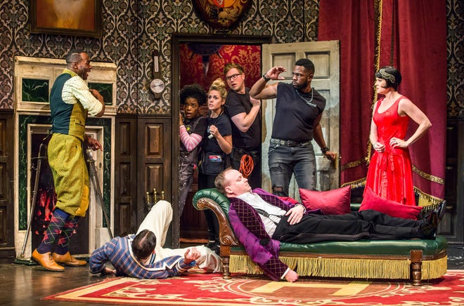 From left, Clifton Duncan, Alex Mandell (floor), Ashley Bryant, Katie Sexton, Ned Noyes, Jonathan Fielding, Akron Watson, Amelia McClain in "The Play That Goes Wrong" at the Lyceum Theatre on Broadway. [Jeremy Daniel photo]