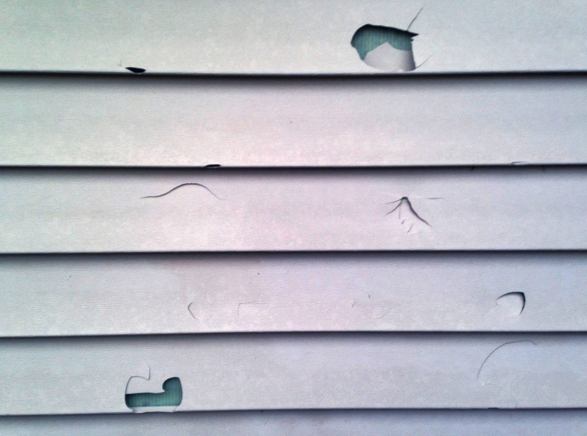 At Home Adhesive tape fixes holes in vinyl siding