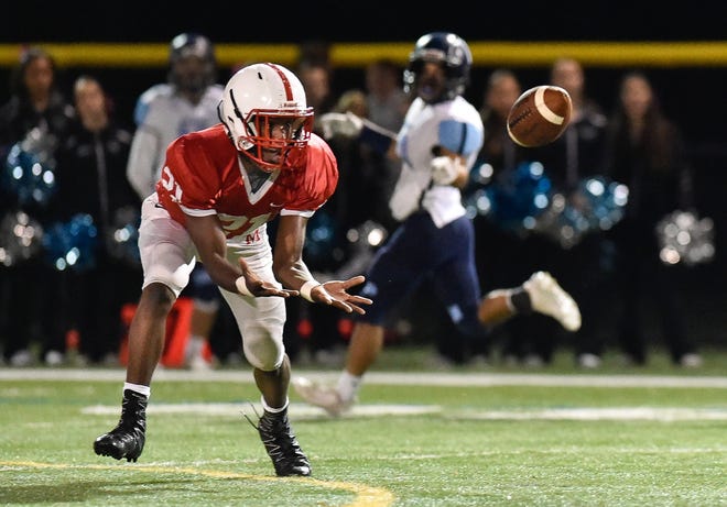 Kevin Peete of Melrose makes this completion during their 14-10 win over Dracut at Melrose High School, Friday, Oct. 27, 2017. [Wicked Local Staff Photo / David Sokol]
