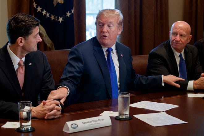 In this Nov. 2, 2017, photo, President Donald Trump speaks during a meeting on tax policy with Republican lawmakers in the Cabinet Room of the White House in Washington, with House Speaker Paul Ryan of Wis., and Chairman of the House Ways and Means Committee Rep. Kevin Brady, R-Texas, right. Terrorism, taxes and Russia tribulations provided fertile ground for President Donald Trump and others to sow confusion over the past week. (AP Photo/Evan Vucci)
