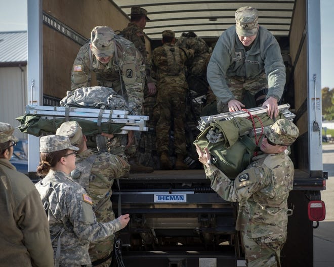Soldiers from the Illinois Army National Guard’s 933rd Military Police Company prepare to deploy to Puerto Rico in Peoria, Ill., Nov. 3, 2017. The unit sent 154 soldiers to the island in support of the Hurricane Maria domestic operations response. (U.S. Air National Guard photo by Tech. Sgt. Lealan Buehrer)