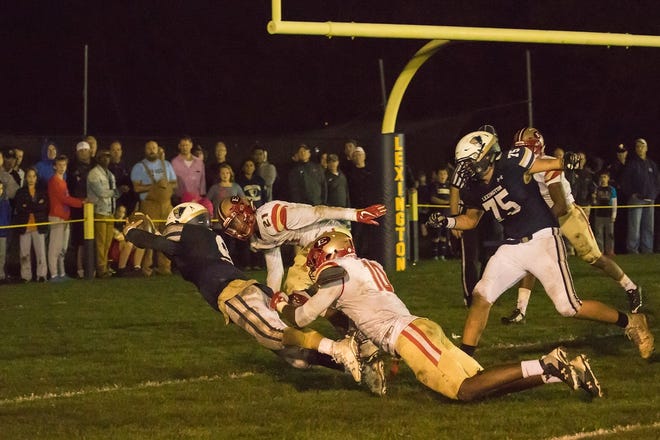 Sal Frelick leaps into the end zone with a touchdown against Everett. [Courtesy photo]