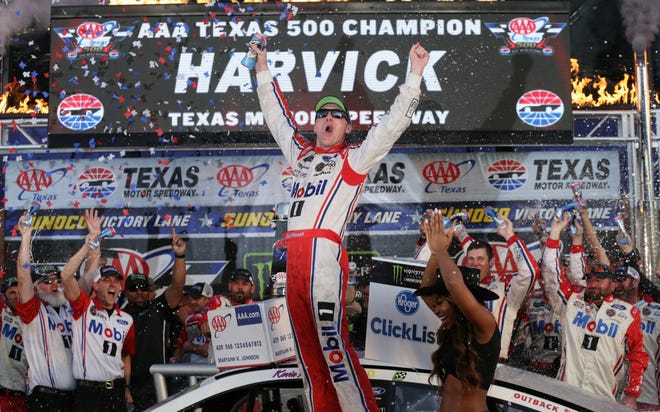 Kevin Harvick celebrates in Victory Lane after winning the NASCAR Cup Series auto race at Texas Motor Speedway in Fort Worth, Texas, Sunday, Nov. 5, 2017. (AP Photo/LM Otero)