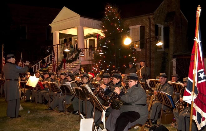 Members of the Alabama 5th Regiment Infantry Band perform in front of Shirley Place during a pre-Christmas event in Northport. [Carmen Sisson/The Tuscaloosa News/File]