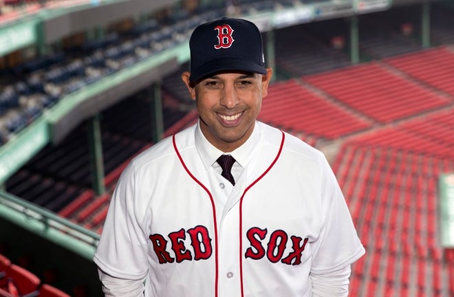 New Red Sox manager Alex Cora poses in Fenway Park following an introductory news conference in Boston on Monday.
