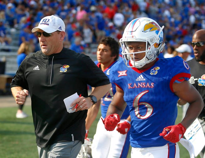 Kansas football coach David Beaty, left, has gone 3-30 in two-plus seasons in Lawrence. (File photograph/The Capital-Journal)